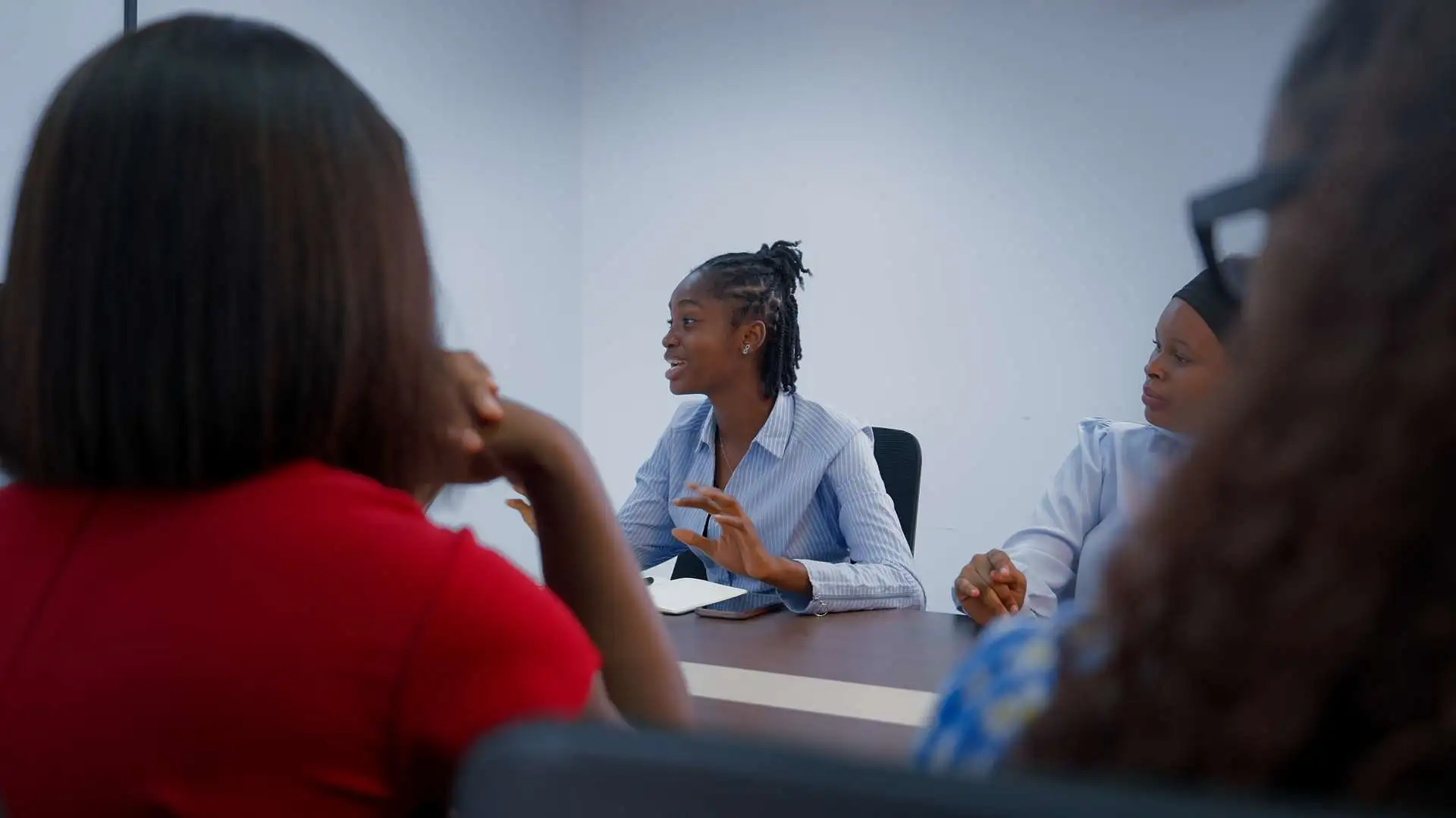 Working professionals studying at Wellspring University